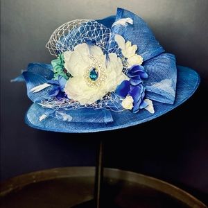This beautiful light as a feather Derby Hat is fabulous . New and never worn .